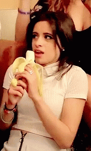 banana eat with both hands GIF